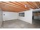 Spacious unfinished basement with exposed wood ceiling, offering potential for customization and storage at 7421 Rogers Dr, Indianapolis, IN 46214