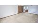 Spacious bedroom with carpet and view of a hall and full bathroom at 7421 Rogers Dr, Indianapolis, IN 46214