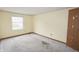 Bedroom with a large window and floral wallpaper border offering a comfortable space at 7421 Rogers Dr, Indianapolis, IN 46214