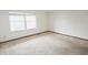 Bright bedroom featuring a large window and neutral wall color, needing some TLC at 7421 Rogers Dr, Indianapolis, IN 46214