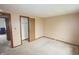 Bedroom featuring neutral walls, carpet, and an open closet, offering a blank canvas for personalization at 7421 Rogers Dr, Indianapolis, IN 46214