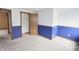 Bedroom with blue and white walls and closet space offering a blank canvas at 7421 Rogers Dr, Indianapolis, IN 46214
