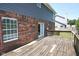 The wooden deck provides access to a grassy backyard with a fenced perimeter for serene outdoor living at 7421 Rogers Dr, Indianapolis, IN 46214