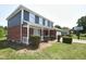 Beautiful two-story home with brick accents, a front porch, and a two-car garage at 7421 Rogers Dr, Indianapolis, IN 46214