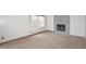 Fireplace with grey tiles from floor to ceiling, light-colored walls, and damaged carpet at 7421 Rogers Dr, Indianapolis, IN 46214