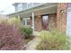 Charming front porch with brick facade and trimmed with white columns at 7421 Rogers Dr, Indianapolis, IN 46214