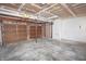 Garage with bare drywall, unfinished ceiling and a door that is fully operational at 7421 Rogers Dr, Indianapolis, IN 46214