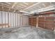 Spacious garage with bare drywall, unfinished ceiling, and a functional garage door opener system at 7421 Rogers Dr, Indianapolis, IN 46214