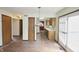 Eat-in kitchen with light wood cabinets, standard appliances, and sliding glass door access to the deck at 7421 Rogers Dr, Indianapolis, IN 46214