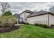 Spacious backyard featuring a patio with outdoor seating, lush green lawn, and manicured landscaping at 7957 Preservation Dr, Indianapolis, IN 46278