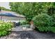 Backyard patio featuring comfortable lounge chairs, a fire pit, and professional landscaping, creating an ideal outdoor retreat at 7957 Preservation Dr, Indianapolis, IN 46278