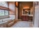 Soak in this luxurious tub with a beautiful view in this bathroom with a separate vanity area at 7957 Preservation Dr, Indianapolis, IN 46278