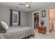 Comfortable bedroom with plush carpeting, open closet, and a charming window view at 7957 Preservation Dr, Indianapolis, IN 46278