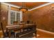 Elegant dining room featuring hardwood floors, decorative walls, and a classic chandelier at 7957 Preservation Dr, Indianapolis, IN 46278