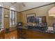 Stylish home office with hardwood floors, large windows, and a spacious executive desk at 7957 Preservation Dr, Indianapolis, IN 46278