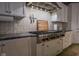 A professional grade range is highlighted in this kitchen with stone backsplash and granite countertops at 7957 Preservation Dr, Indianapolis, IN 46278