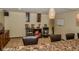 Relaxing living room with a bar featuring decorative shelves and marble countertop at 7957 Preservation Dr, Indianapolis, IN 46278