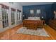 This main bedroom features a seating area, ensuite bathroom, and beautiful natural light at 7957 Preservation Dr, Indianapolis, IN 46278