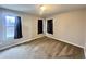 Bright bedroom with two windows and cozy neutral-toned carpeting at 8201 E 250 S, Zionsville, IN 46077