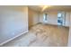 Spacious bedroom with neutral carpet and walls, featuring multiple doorways and ample lighting at 8201 E 250 S, Zionsville, IN 46077