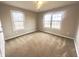 A spacious bedroom with large windows and plush carpeting at 8201 E 250 S, Zionsville, IN 46077