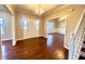 Inviting foyer with gleaming hardwood floors, a staircase, and a view into the adjacent dining room at 8201 E 250 S, Zionsville, IN 46077