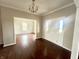Bright foyer with hardwood floors, a chandelier, and an open view into the adjacent room at 8201 E 250 S, Zionsville, IN 46077