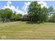 Charming two-story brick home featuring a spacious lawn and mature trees creating curb appeal at 8201 E 250 S, Zionsville, IN 46077