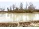 Scenic view of the pond with trees in the background, reflecting the clear sky at 8201 E 250 S, Zionsville, IN 46077