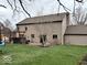 Spacious backyard with a pergola-covered patio and a grassy area, perfect for outdoor entertaining and relaxing at 8212 N Sierra Dr, Muncie, IN 47303