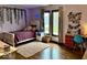 Cozy bedroom featuring a charming decor, plush rug, and natural light at 8212 N Sierra Dr, Muncie, IN 47303