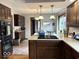 Traditional kitchen with wooden floors, granite countertops, and stainless steel appliances at 8212 N Sierra Dr, Muncie, IN 47303