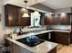 Traditional kitchen featuring dark wood cabinets, granite countertops, and stainless steel appliances at 8212 N Sierra Dr, Muncie, IN 47303