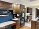 A traditionally styled kitchen featuring dark wood cabinets and a functional desk area at 8212 N Sierra Dr, Muncie, IN 47303