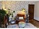 Comfortable living room featuring a chair, bookcase wallpaper, and hardwood floors at 8212 N Sierra Dr, Muncie, IN 47303