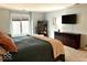 Relaxing main bedroom with a large window, a dresser and a comfortable bed at 8212 N Sierra Dr, Muncie, IN 47303