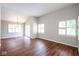 Bright living room featuring wood floors, plantation shutters and a sliding door at 9029 Crook N Dr, Indianapolis, IN 46256