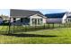 A fenced-in backyard featuring a sunroom at 955 Sand Hollow Dr, Lebanon, IN 46052