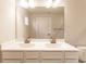 Bathroom featuring a double vanity, neutral color palette, and a large mirror at 955 Sand Hollow Dr, Lebanon, IN 46052