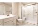 Modern bathroom with a glass-enclosed shower, vanity, and neutral color palette at 955 Sand Hollow Dr, Lebanon, IN 46052