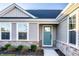 Charming home featuring a stone foundation, large windows, and a stylish front door at 955 Sand Hollow Dr, Lebanon, IN 46052