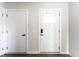 Hallway featuring neutral colored walls, white trim, and a modern interior door at 955 Sand Hollow Dr, Lebanon, IN 46052
