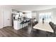 Bright kitchen with an island and seating, stainless steel appliances, and a dining area at 955 Sand Hollow Dr, Lebanon, IN 46052