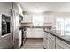 Bright kitchen with stainless steel appliances, island, and granite countertops at 955 Sand Hollow Dr, Lebanon, IN 46052