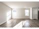 Bright living room with hardwood floors and ample natural light at 955 Sand Hollow Dr, Lebanon, IN 46052