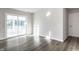 Bright, airy room with sliding glass doors and hardwood floors at 955 Sand Hollow Dr, Lebanon, IN 46052