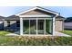 View of the back of the house, featuring a sunroom at 955 Sand Hollow Dr, Lebanon, IN 46052