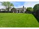 Spacious backyard with a patio, basketball hoop, and plenty of room for recreation at 10622 Young Lake Dr, Indianapolis, IN 46239