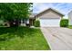 Charming single-Gathering home with a well-maintained lawn, tidy landscaping, and an attached two-car garage at 10622 Young Lake Dr, Indianapolis, IN 46239