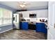 Bright kitchen featuring stainless steel appliances, two-tone cabinetry, and a large window for ample natural light at 10622 Young Lake Dr, Indianapolis, IN 46239